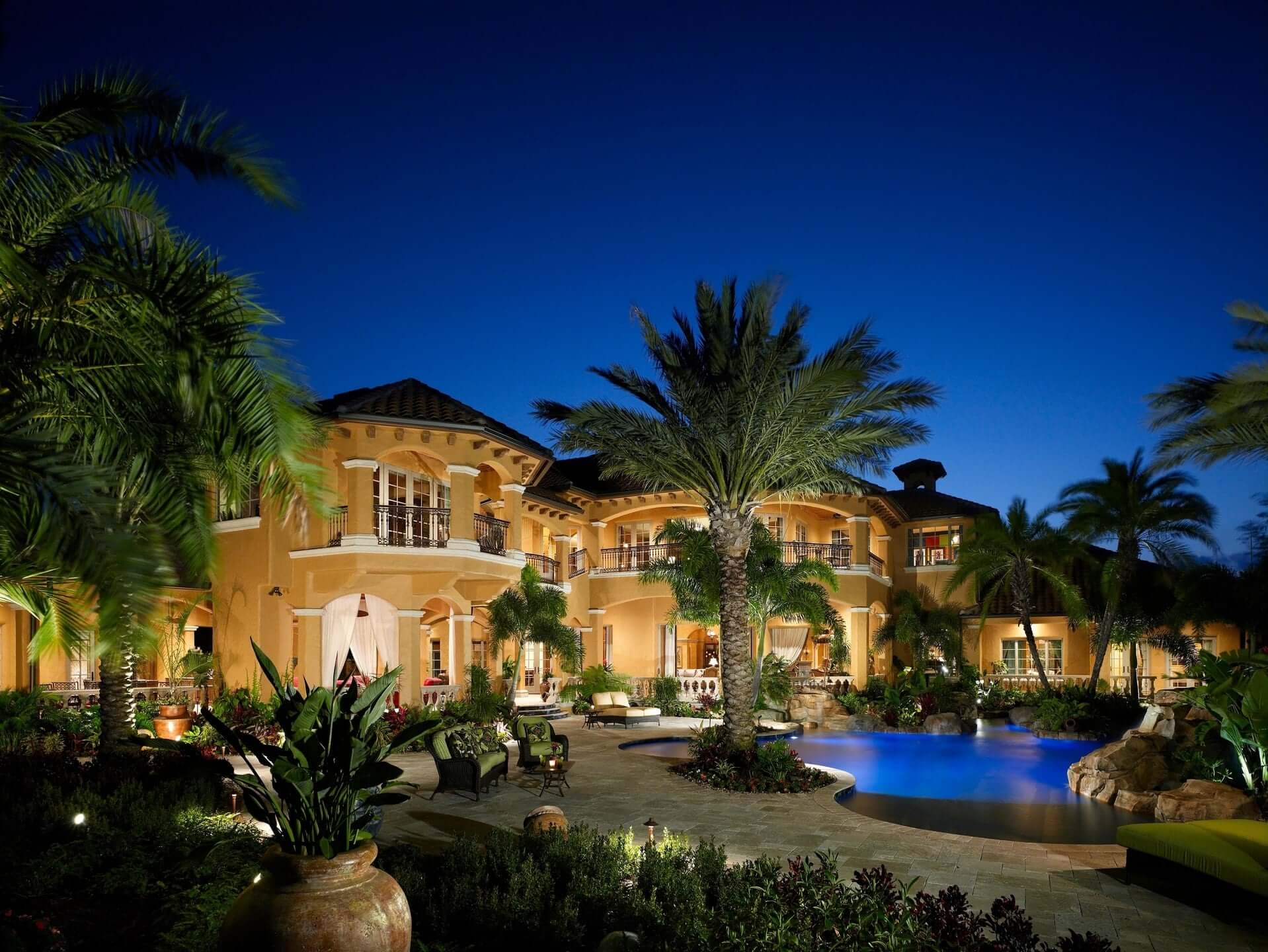 yellow house with palm trees